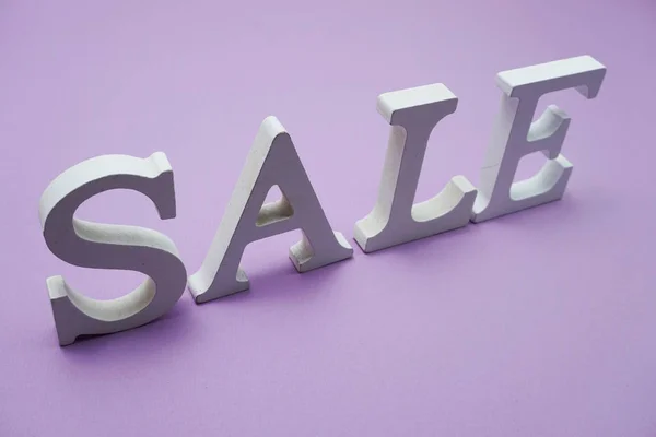 stock image Sale Alphabet Letters with space copy on purple background business concept