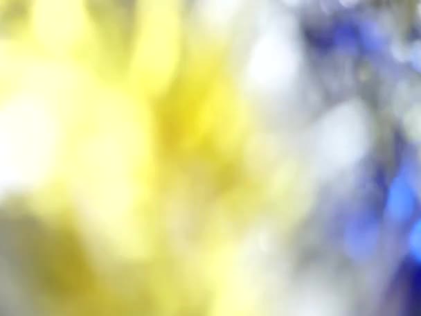 Azzurro e Giallo Astratto azzurro luci bokeh rotazione sfondo — Video Stock