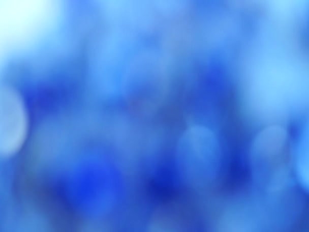 fond abstrait de couleur bleue avec lumière floue bokeh defocus 