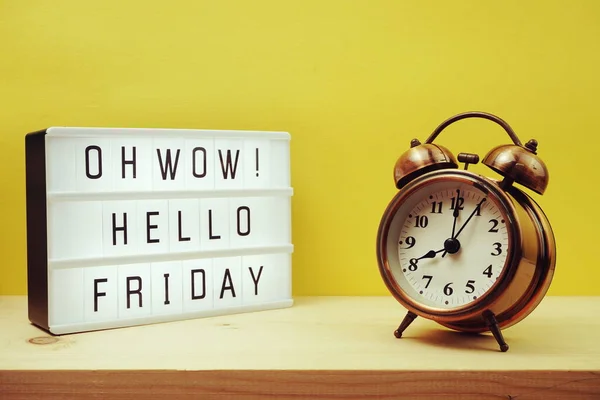 Hello Friday text in light box with space copy on yellow background