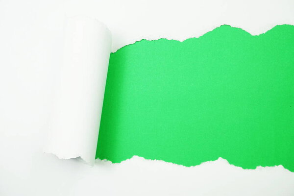 Paper torn with space copy on green background