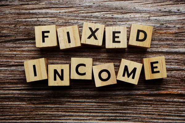 Fixed Income alphabet letter on wooden background