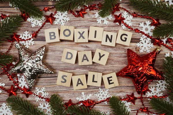 Boxing Day Sale alphabet letter on wooden background with Christmas ornament decoration