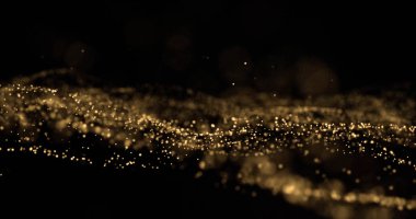 Altın parıldayan ışık parçacıkları su sıçratır, altın parıldayan kıvılcımlar siyah arkaplanda bokeh etkisi yaratır.