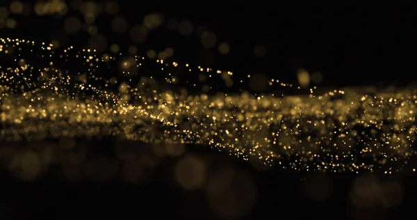 Light glitter wave, golden dust splash and glittering particles glow flow. Gold bokeh light overlay on black background — ストック写真