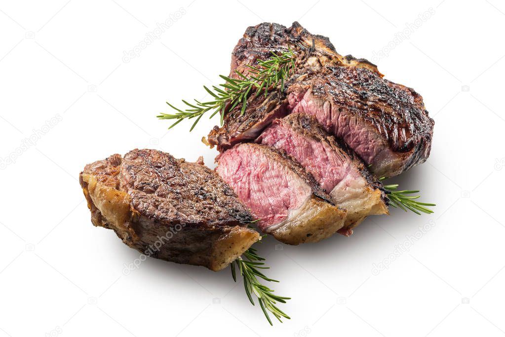 Sliced T-bone steak with rosemary isolated on white background