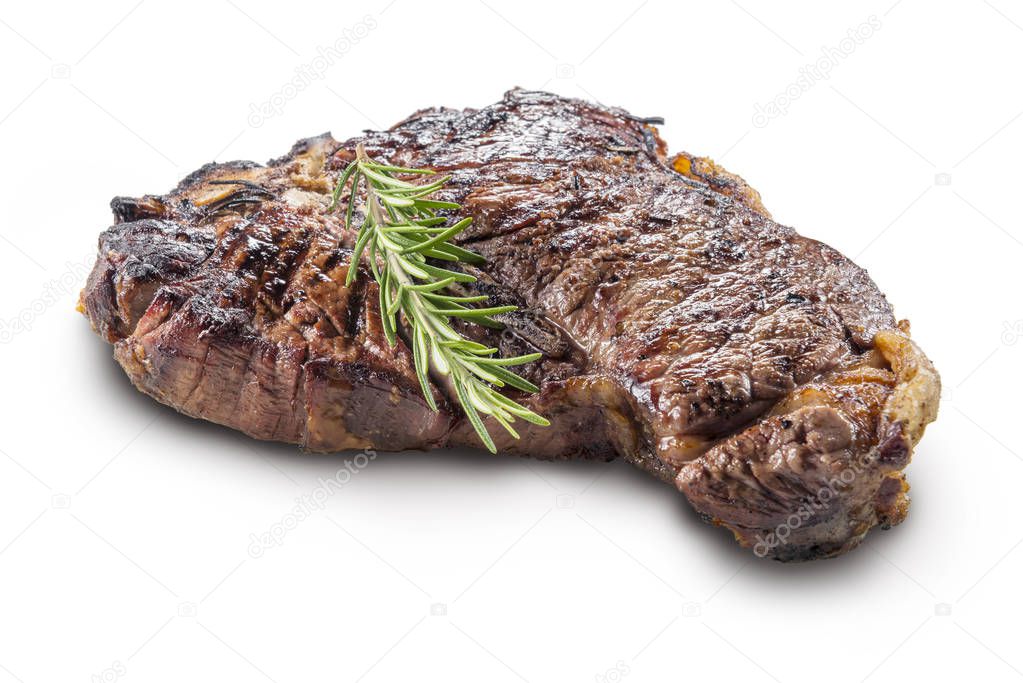 Whole grilled T-bone steak with rosemary isolated on white background