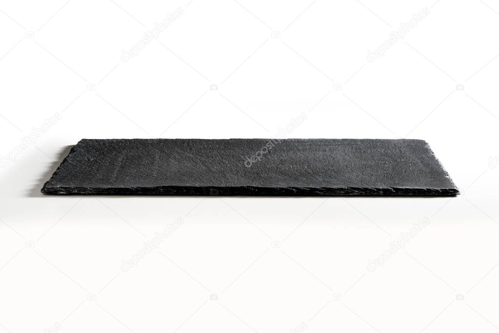 Rectangular empty plate in black slate isolated on white background