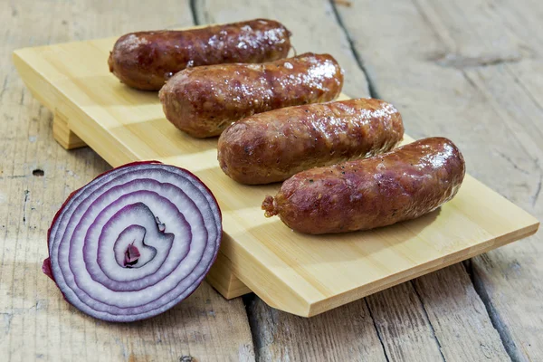 Cutting Board Four Grilled Sausages Rustic Table — Stock Photo, Image