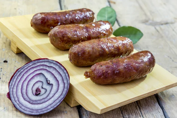 Cutting Board Four Grilled Sausages Rustic Table — Stock Photo, Image