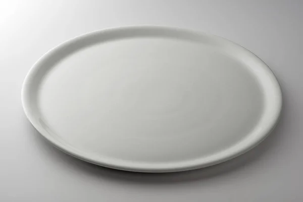 Round flat plate for pizza — Stock Photo, Image