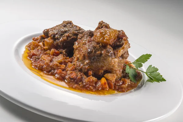Dish with portion of oxtail stewed — Stock Image Dish with portion of oxtail stewed Stock Photo