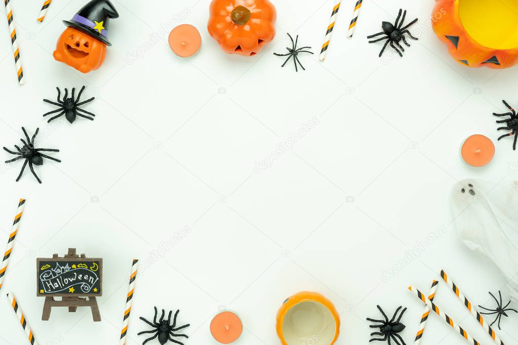 Table top view aerial image of decoration Happy Halloween day background concept.Flat lay accessories essential object to party the pumpkin & spider decor on white wooden.Space for creative design.