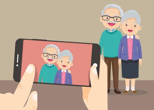 Sostener la mano teléfono inteligente con los abuelos tomar una foto — Vector de stock