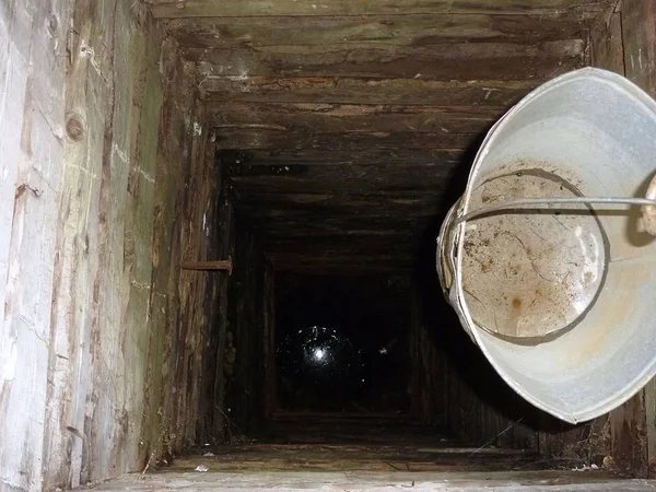 Deep mine village well with bucket — Stock Image Deep Mine Village Well Bucket Royalty Free Stock Photos
