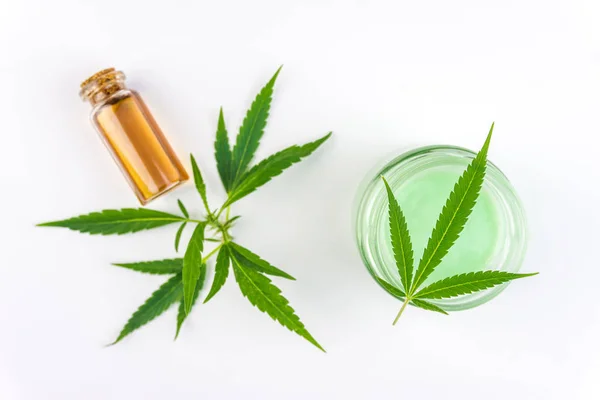 CBD Cannabis Hemp topical cream and oil balm with cannabis leaf isolated — Stock Photo, Image