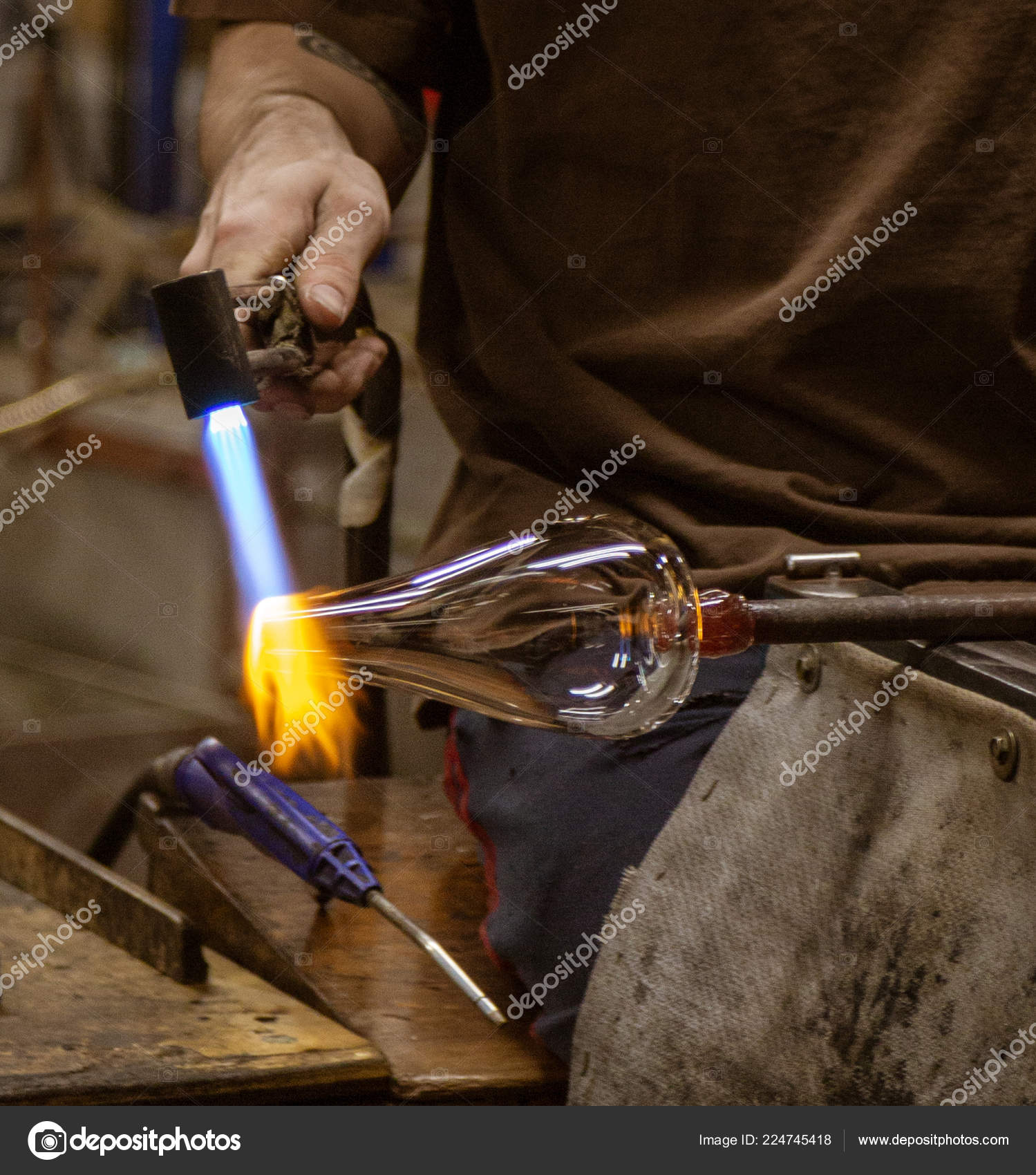 Glass Blowing Artist Forms Blob Glass Vessel Using Gas Torch Stock