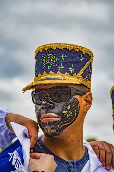 Latacunga, Ecuador - September 22, 2018 - Young men dress in decorated Black Face to celebrate African slave that saved the town in the 17th century. — Stock Photo, Image