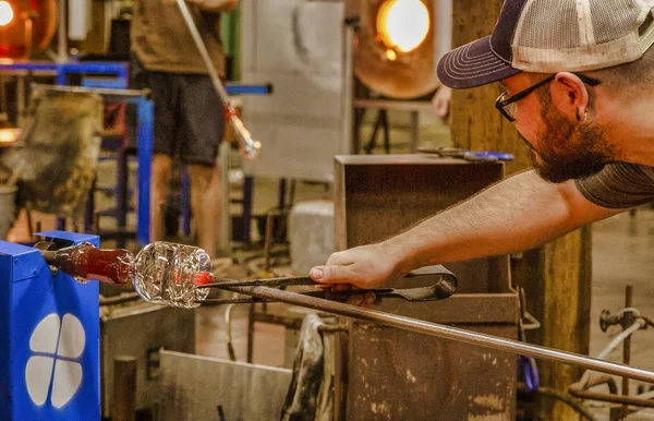 Glass Blowing Artist Forms Blob Glass Vessel Using Gas Torch Stock