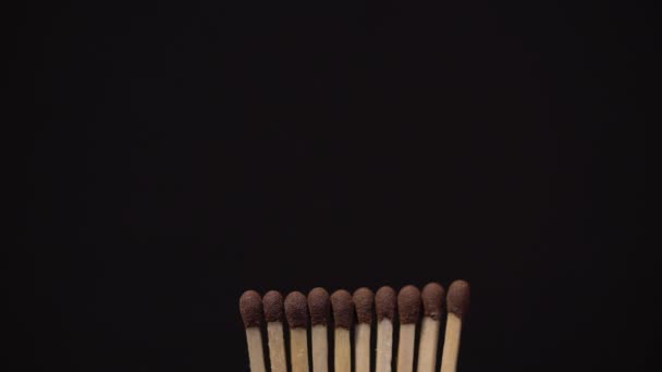 Close Up of Row Of Ten Match Sticks Being Lit. — Stock Video