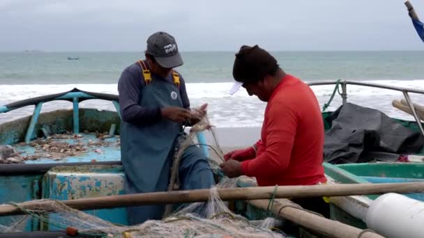 San Pedro, Ecuador - 20180915 -  Two Men Fix Two Nets. — Stock Video