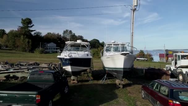 Chebeague Island, Maine  -  20181006  -  Aerial Drone  -  Rise In Front Of Two Boats In Dry Dock. — Stock Video