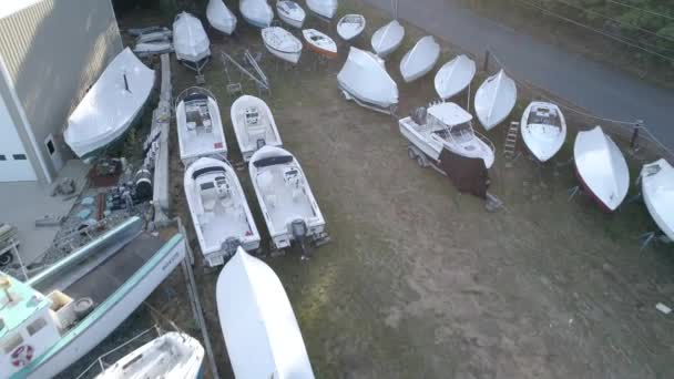 Chebeague Island, Maine  -  20181006  -  Aerial Drone  -  Fly Backwards Over Dry Dock Boats. — Stock Video