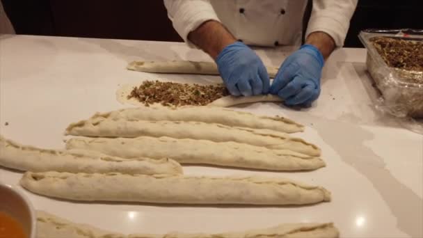 Making Turkish Style Pide step 3 closing the dough — Stock Video