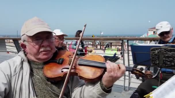 Tel Aviv, Israel - 2019-04-27 - Elderly String Musicians at Beach with Sound 1 - violin closeup — Stock Video