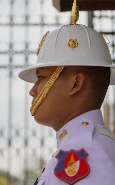 Bangkok, Tahiland - 2019-03-04 - Man Stands Guard at the Grand Palace