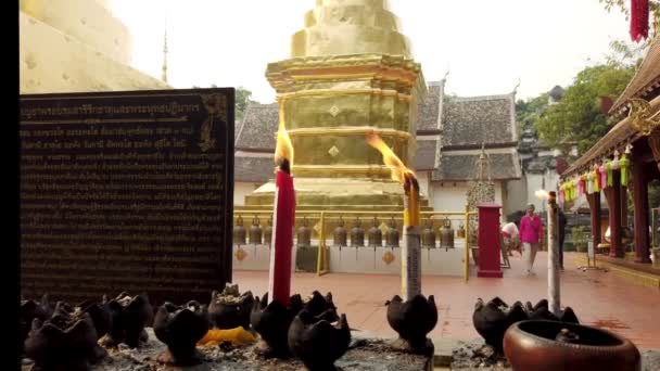 Chiang Mai, Thailand - 2019-03-15 - Candles Burn In Front of Stupa — Stock Video