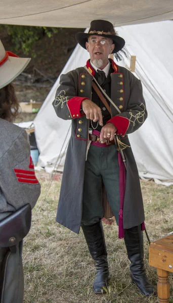 Man stands in Confederate officer uniform — 스톡 사진