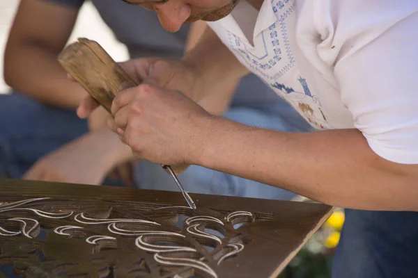 Tashkent, Uzbekistan - May 18, 2017 - Artisan creates fine art with wood