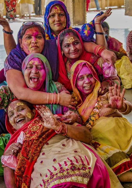 Barsana, India - February 23, 2018 - Women laugh and ham it up for cameras, while covered in paint in Holi festival — Stock Photo, Image