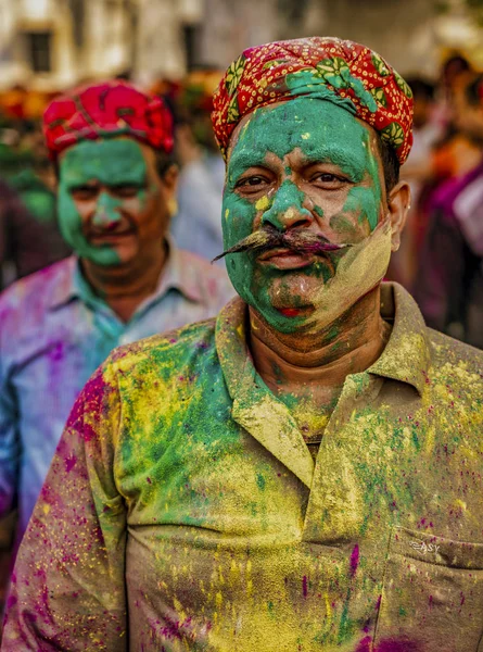 Barsana, India - February 23, 2018 - A man proudly shows off the mass of colors he has accumulated in Holi festival — Stock Photo, Image
