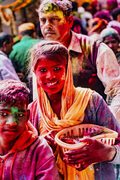 Barsana, India - February 23, 2018 - A woman and her son wait in line to give offerings at a temple in Holi festival — Stock Photo, Image