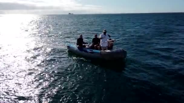 Galapagos, Ecuador - 2019-06-20 - island landing boat approaches tour boat — Stock Video