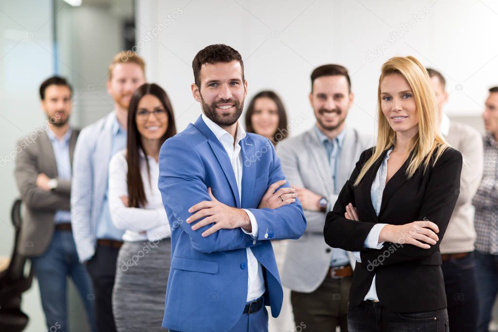 Portrait of successful business team posing in office