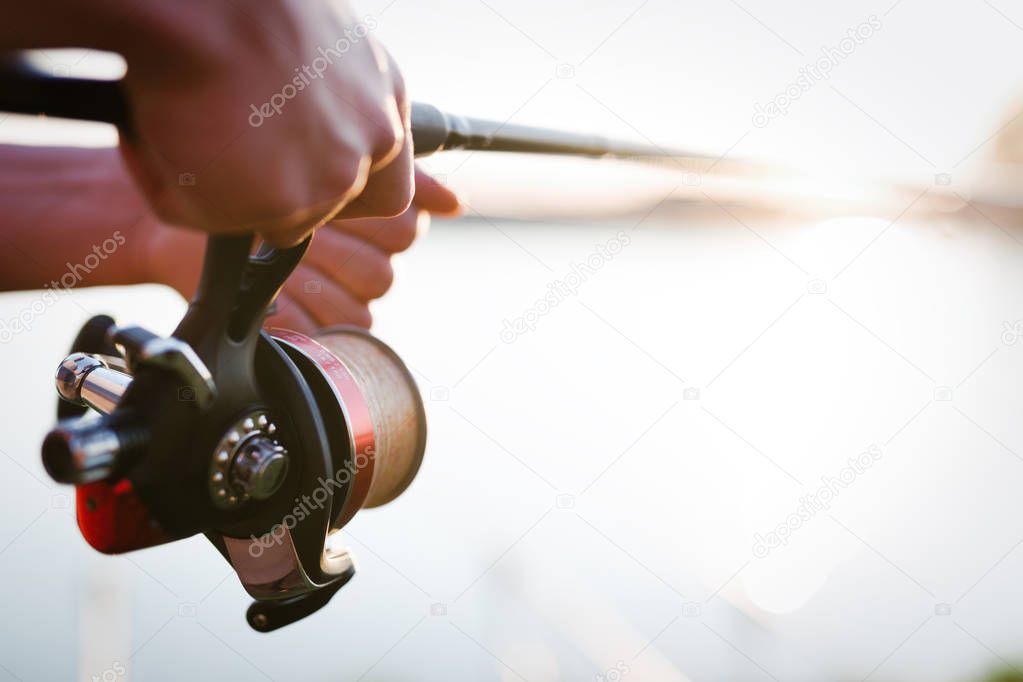 Fishing, hobby and recreational concept - fishermen sports