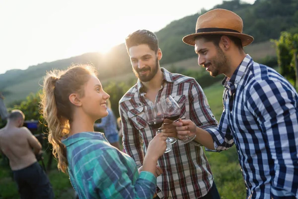 Wine grower and people in winery vineyard