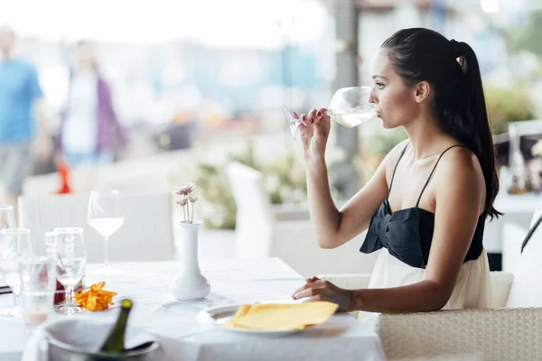 Woman Tasting White Wine Restaurant Lifting Glass Accordingly — Stock Photo, Image