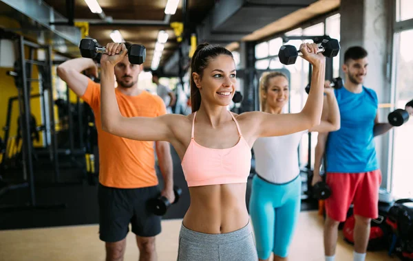 People have workout in gym Stock Photo by ©nd3000 157845922