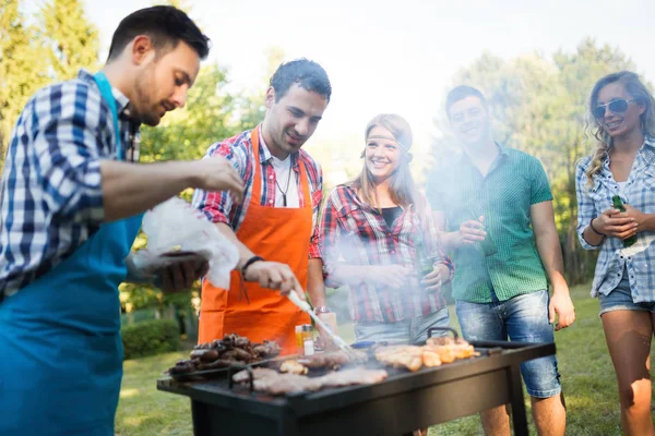 Happy Friends Enjoying Barbecue Party Outdoors — Stock Photo, Image