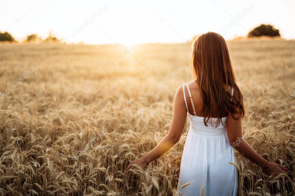 Young beautiful happy woman spending time in nature