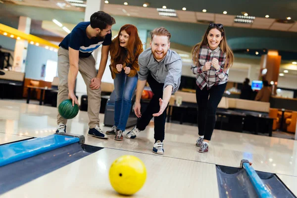 Friends having fun while bowling — Stock Photo, Image