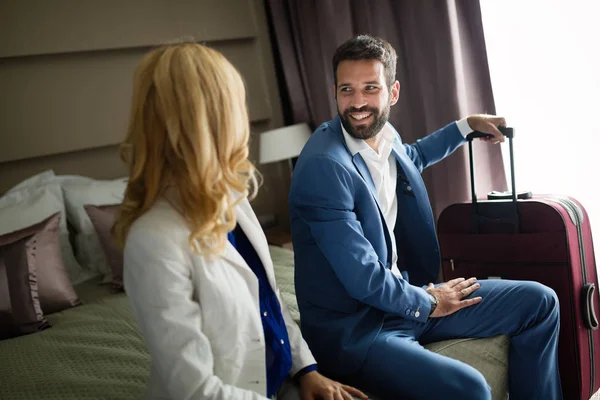 Businesspeople on business trip staying in hotel together