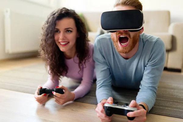 Happy Young Couple Playing Video Games Virtual Reality Headsets Home — Stock Photo, Image