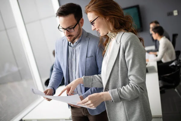 Business people planning strategy in modern office together