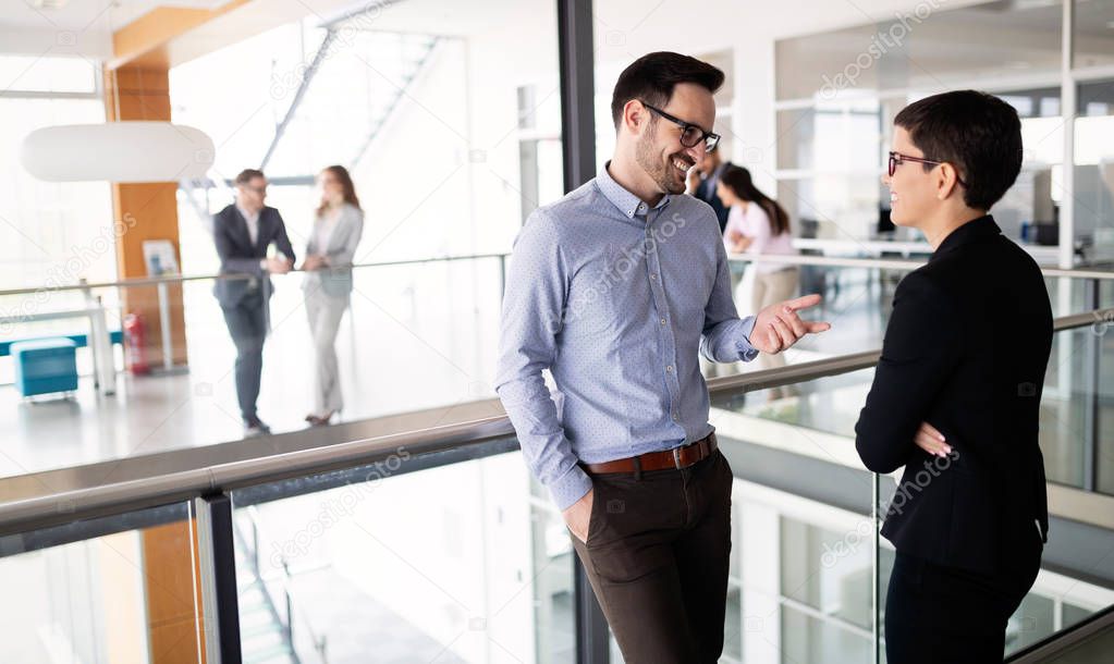 Business partners and colleagues having conversation during coffee break