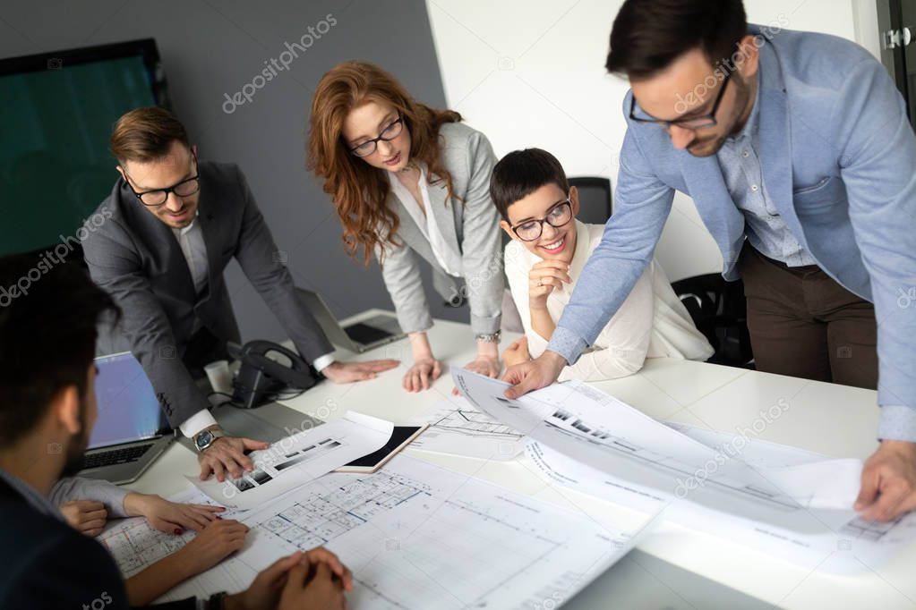 Group of business people collaborating on project in office